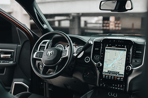 A car dash with infotainment screen.