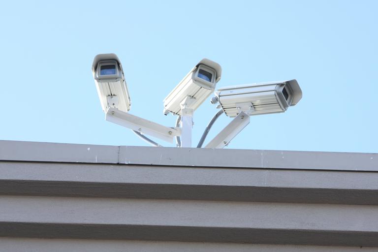 3 surveillance cameras on a rooftop